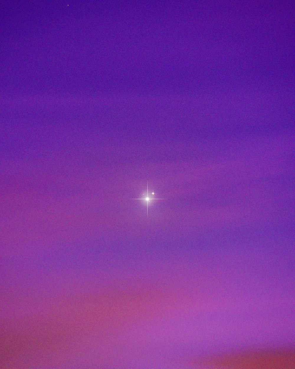 purple and blue sky with stars