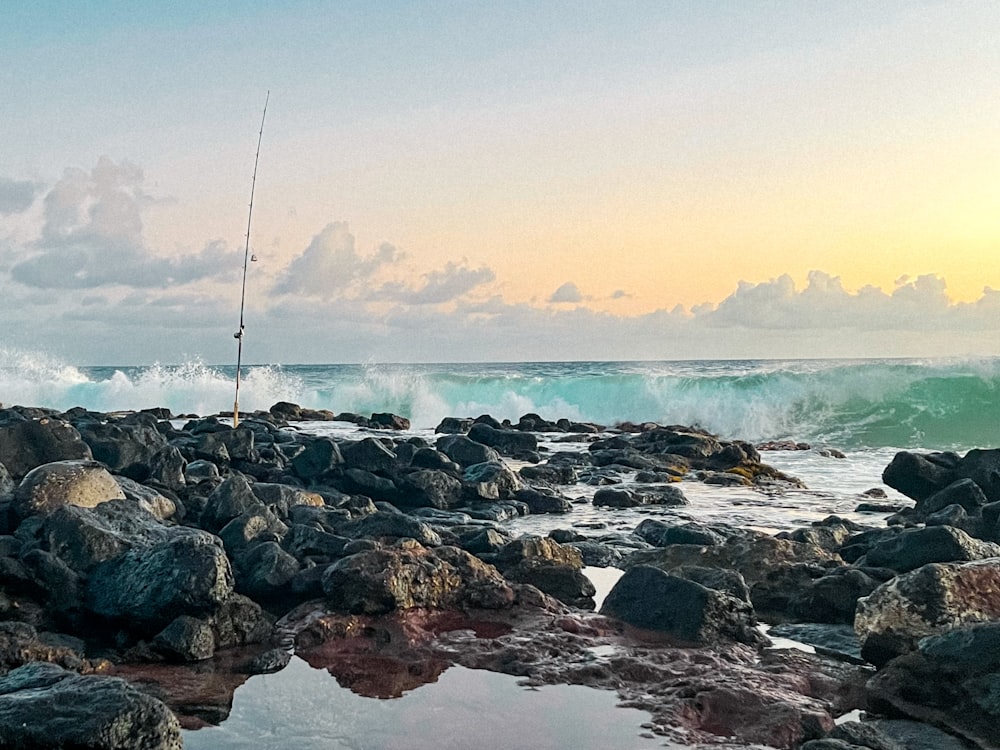 rocky shore with calm sea water during daytime