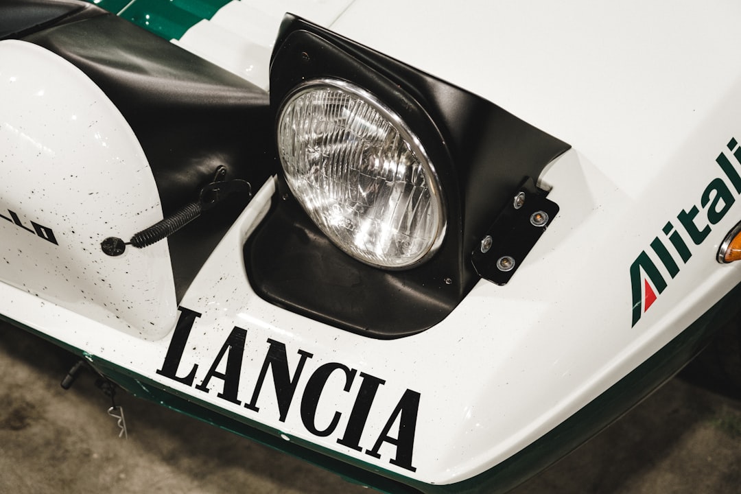 white and black car with white and green license plate