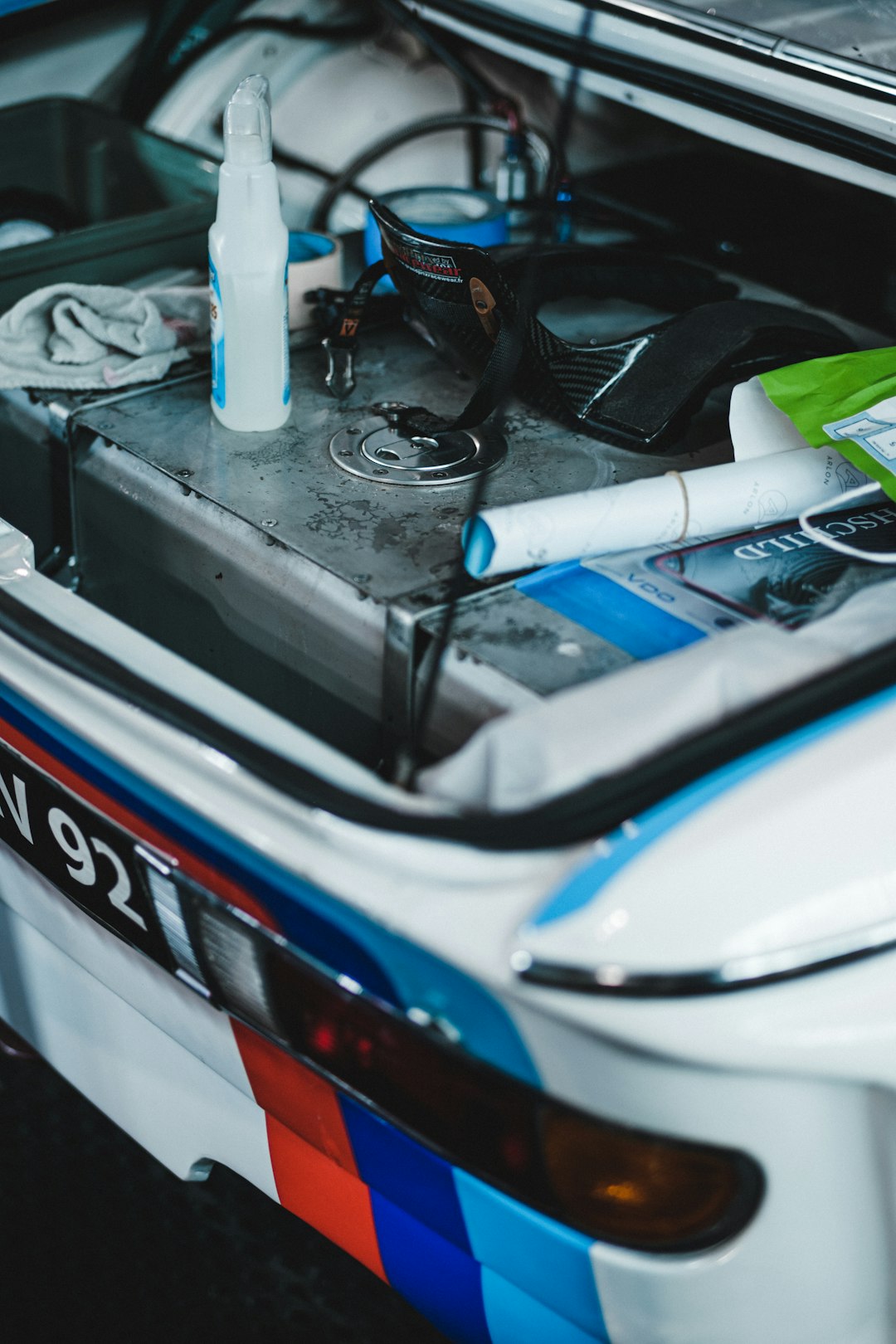 white and blue car engine bay