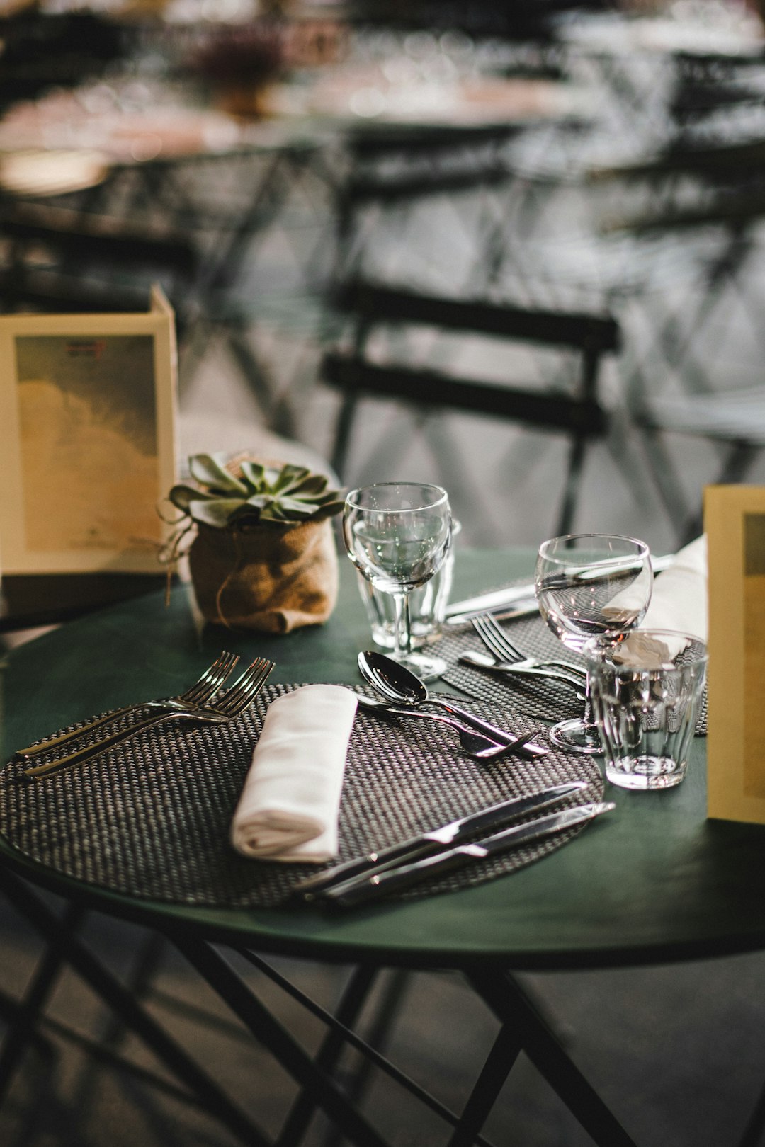 silver fork and bread knife on black round table