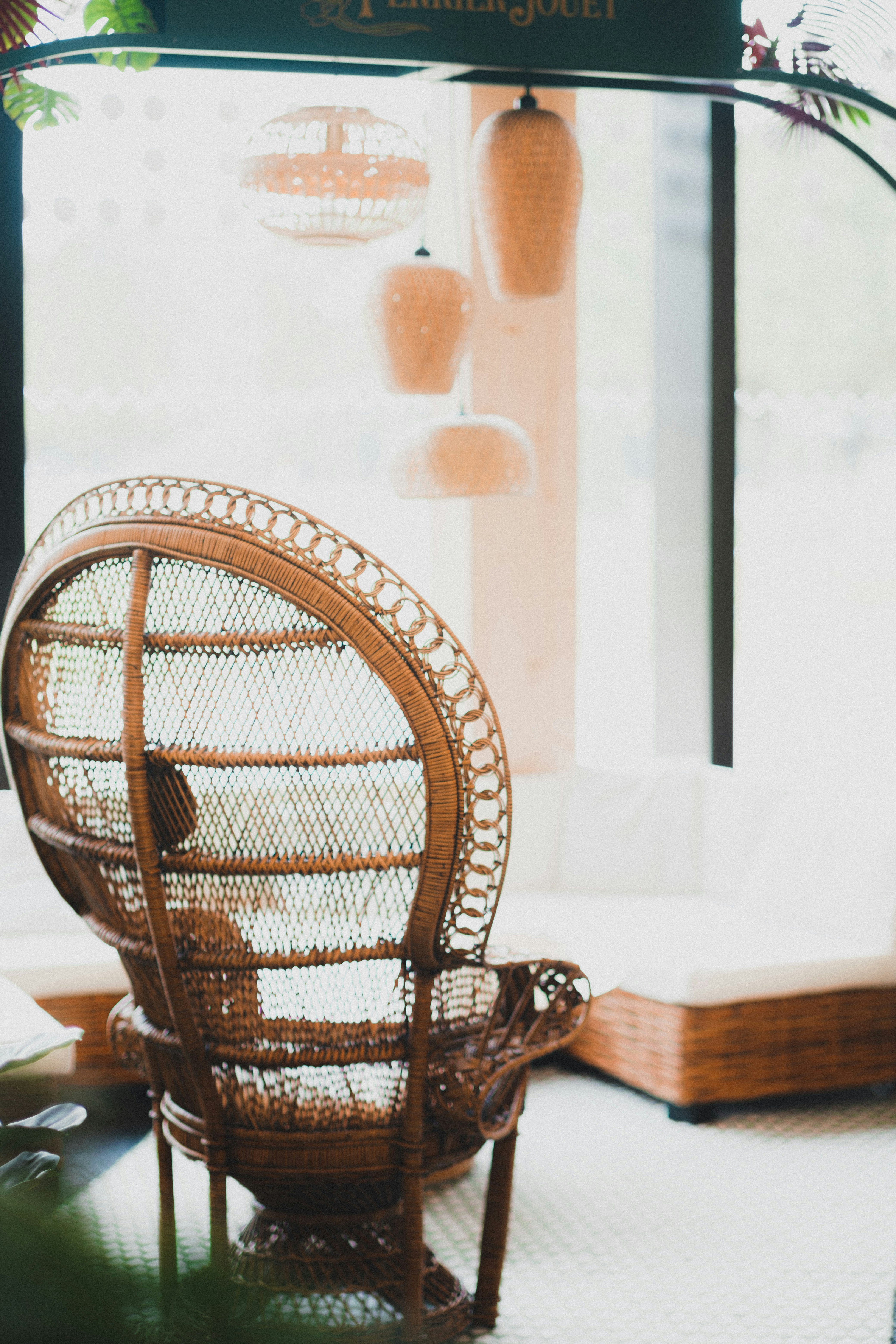 brown woven chair near white table