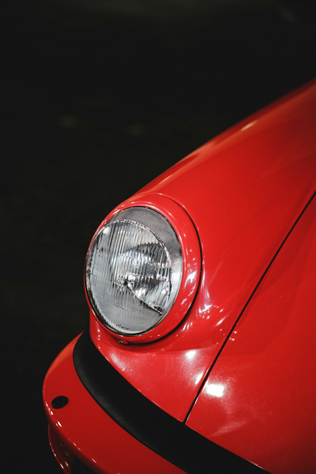 red car with silver headlight