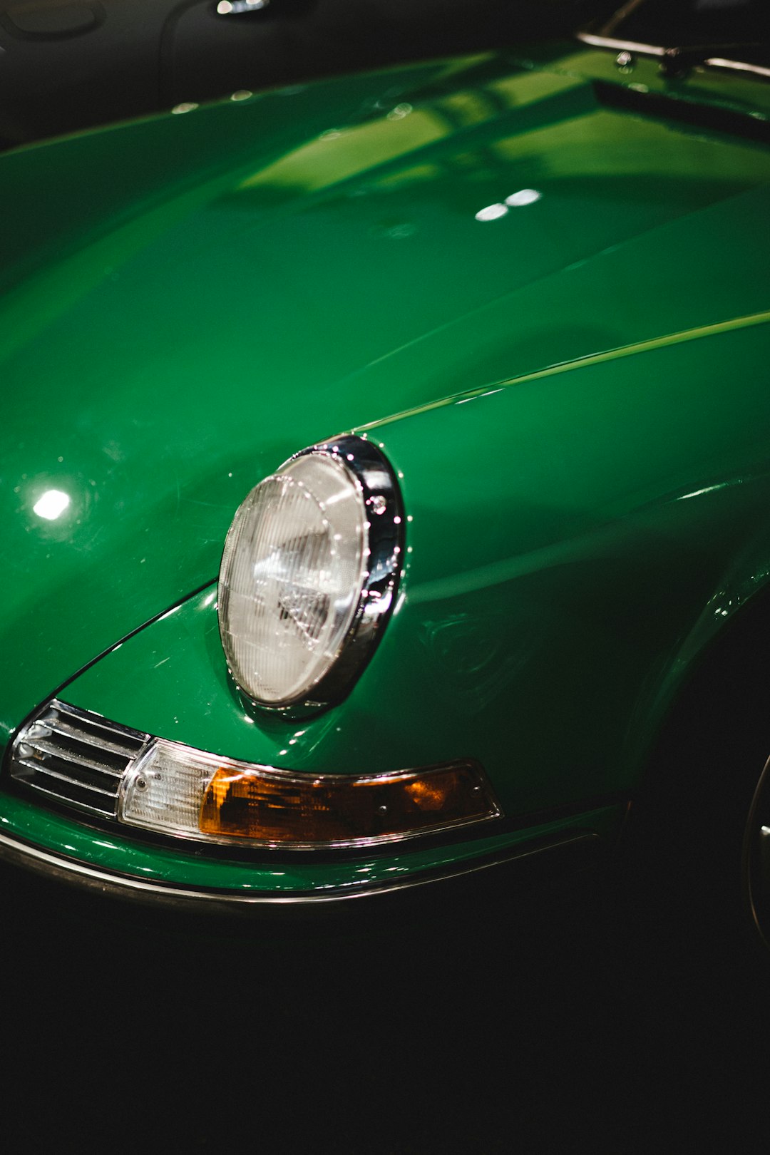 green car with silver headlight