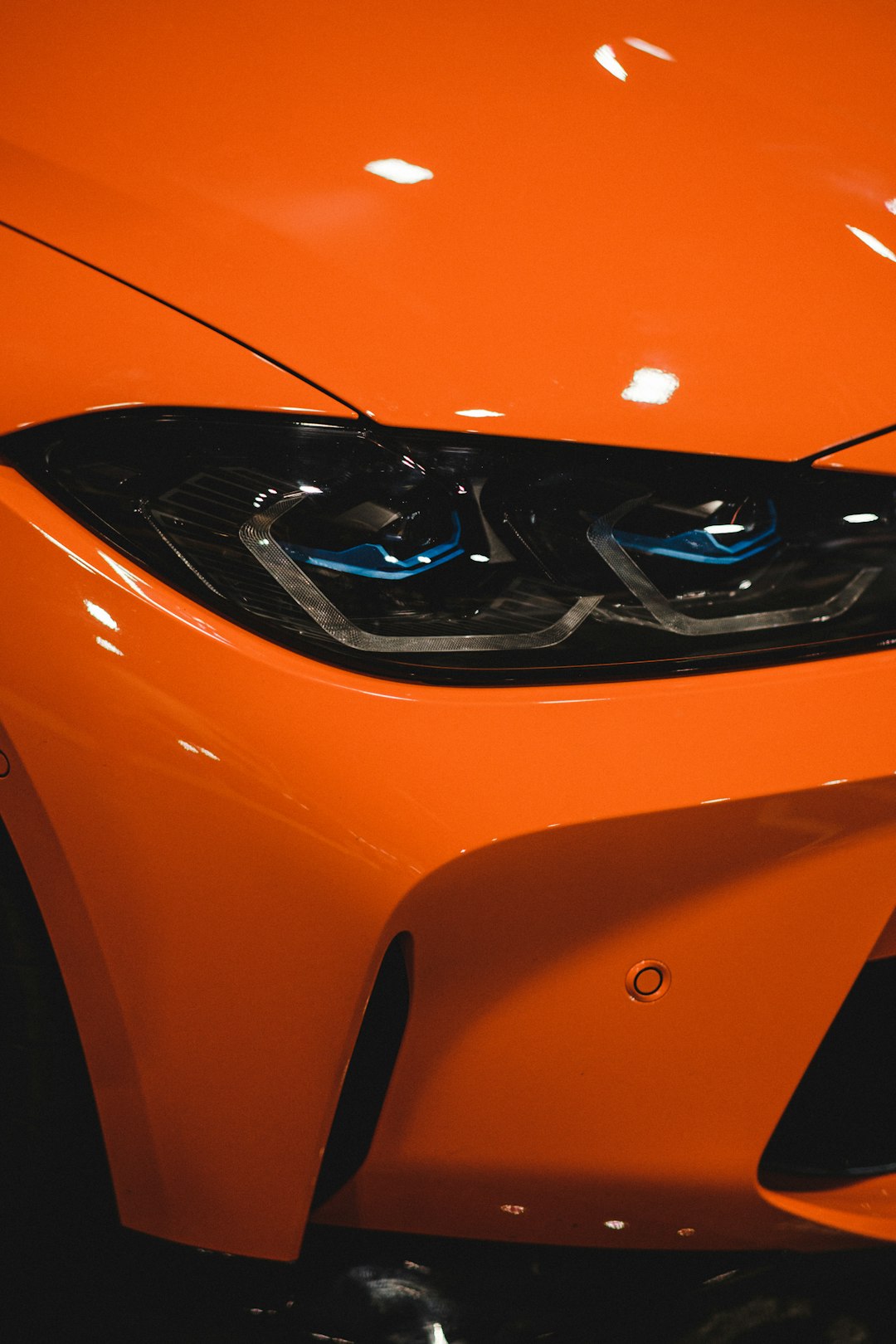 orange ferrari car in close up photography