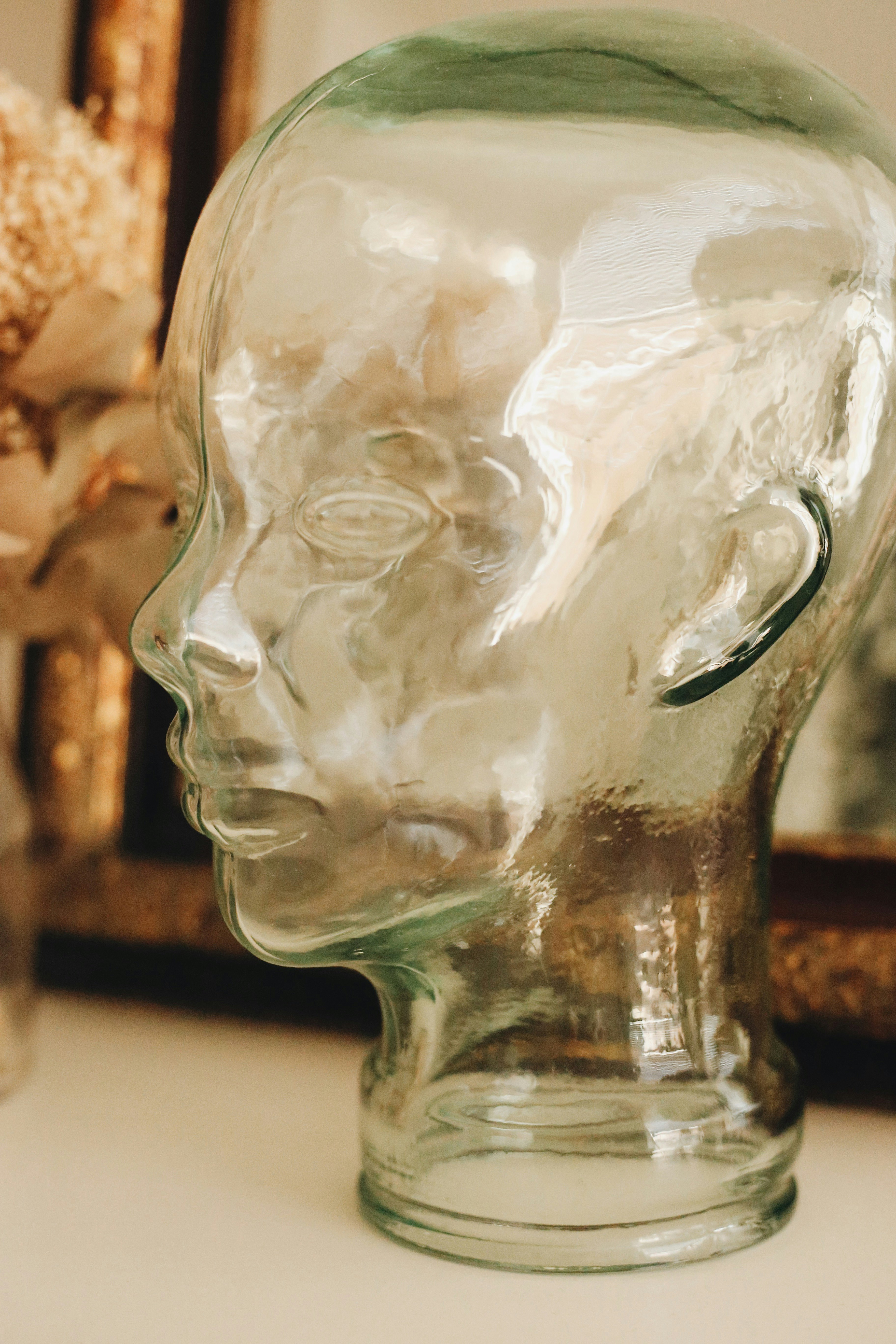 clear glass vase on white table