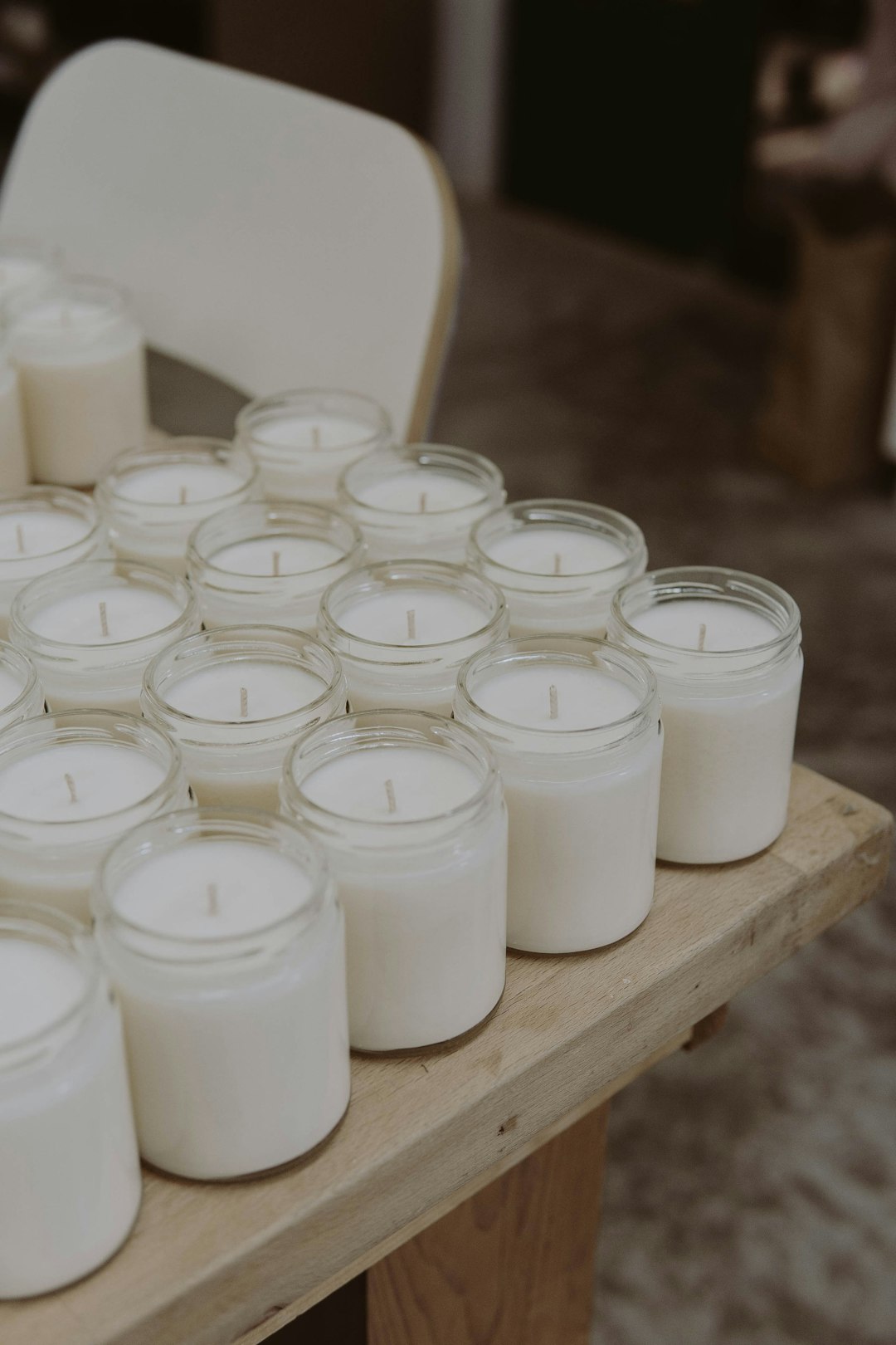 white candles on white wooden table