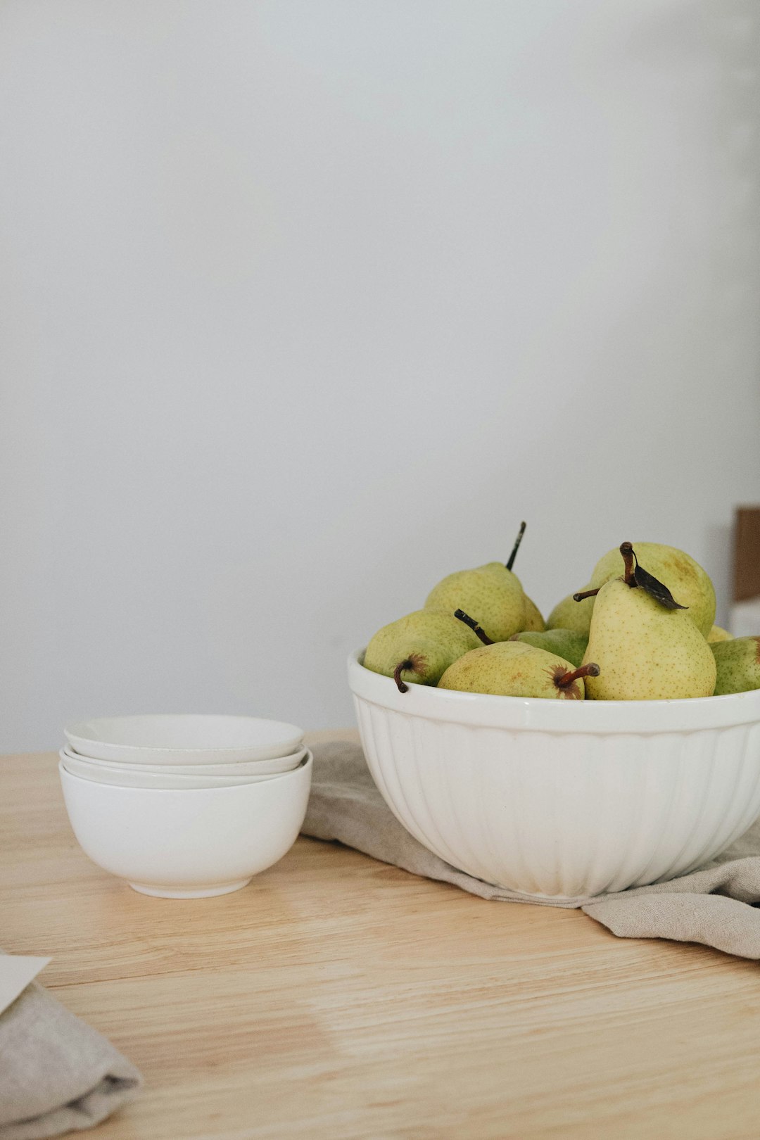 sliced apple fruit on white ceramic bowl