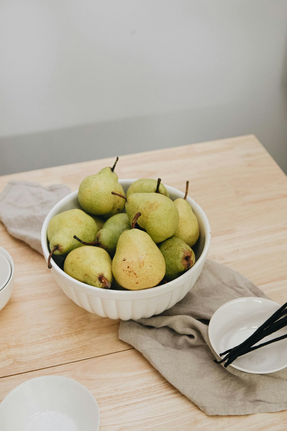 green apple fruit on white ceramic bowl