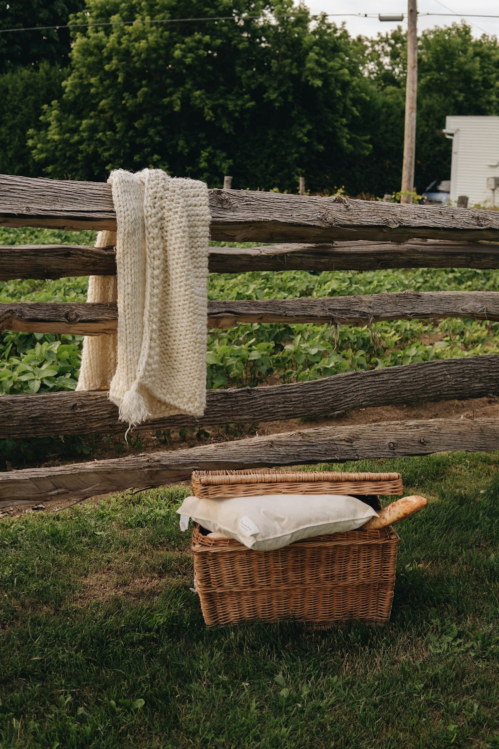 white textile on brown woven basket