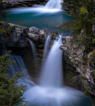 water falls on rocky mountain