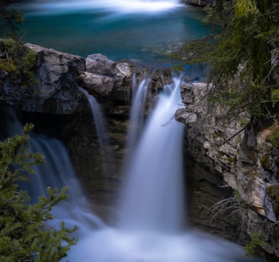 water falls on rocky mountain