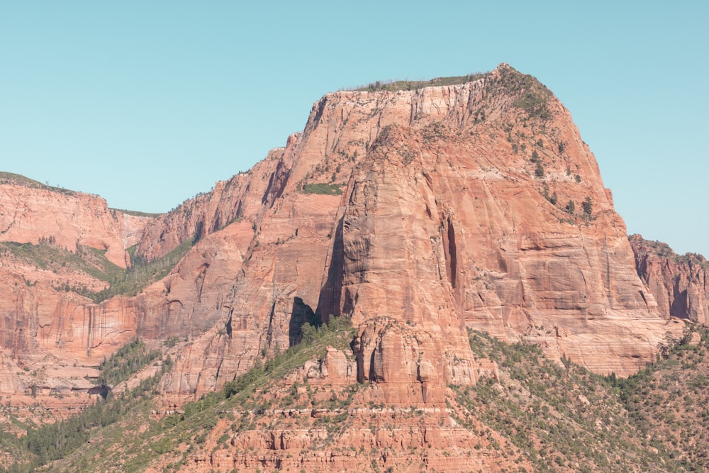 brown rocky mountain under blue sky during daytime