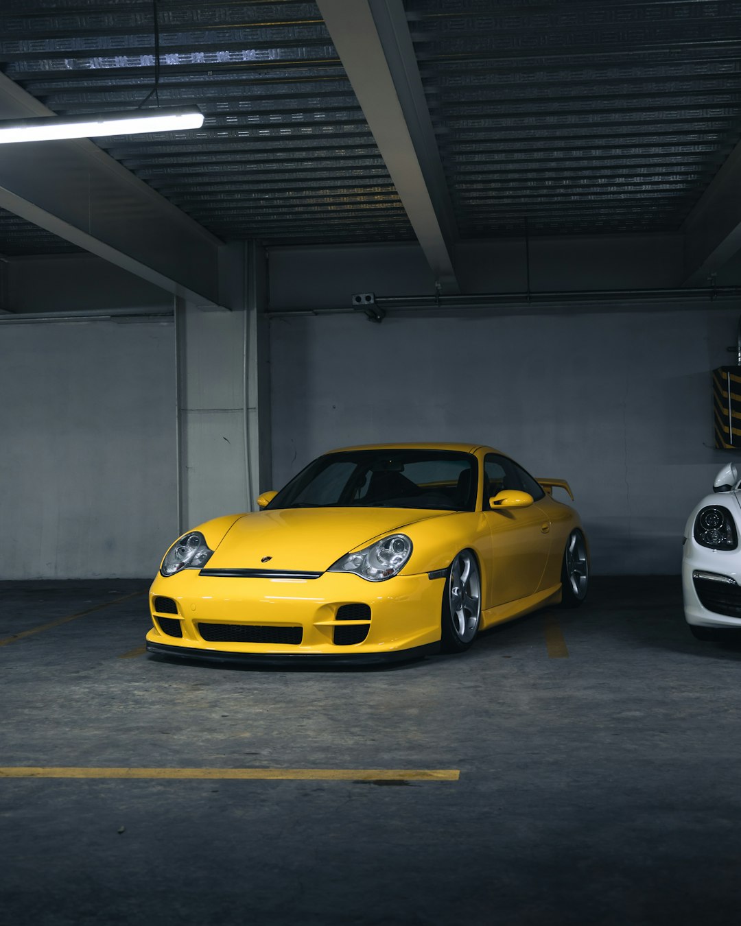 yellow ferrari 458 italia parked in a garage
