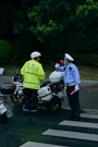 2 men in green jacket riding motorcycle during daytime