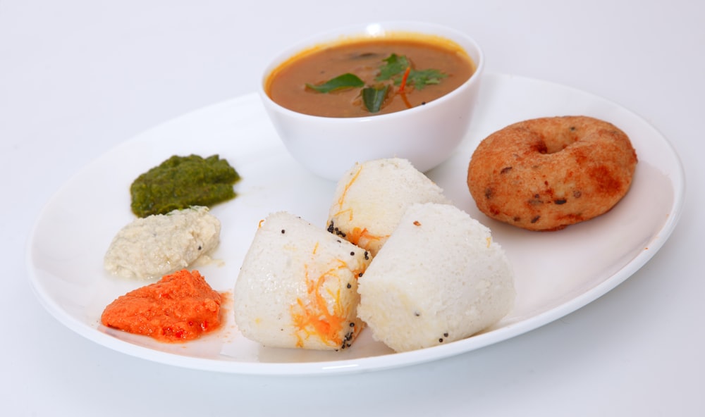 white ceramic bowl with rice and meat dish