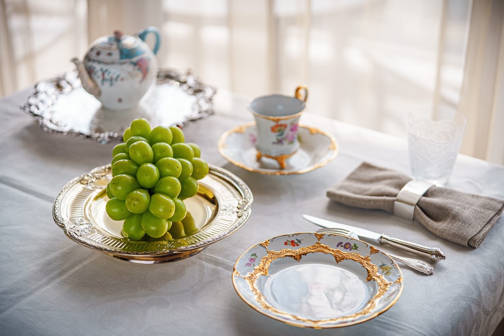 green grapes on white and blue floral ceramic plate