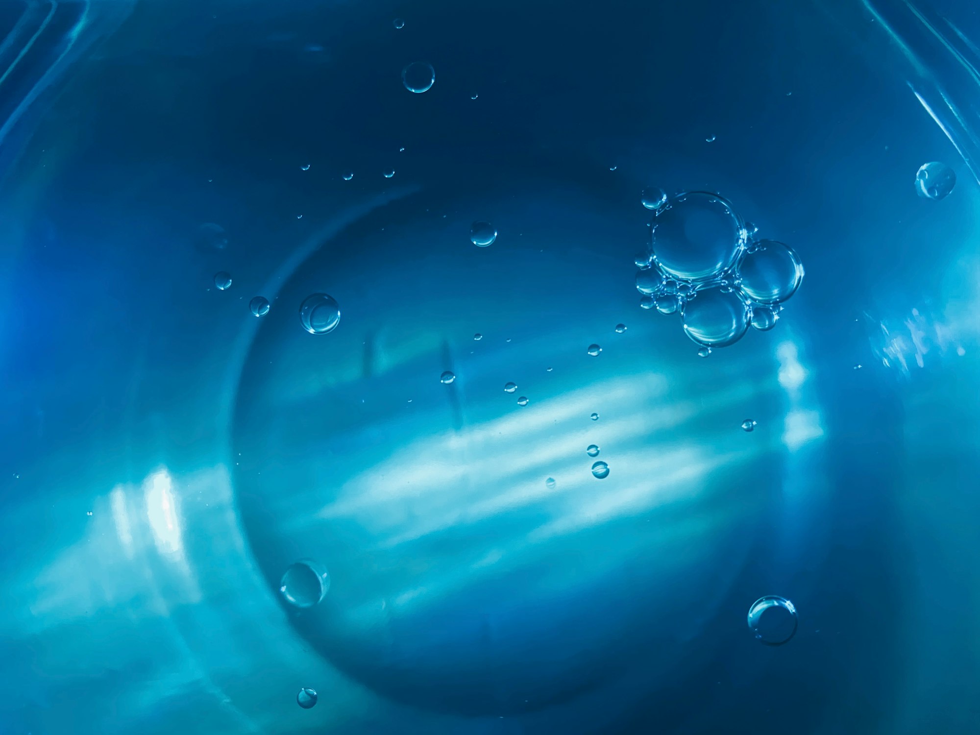 water droplets on blue plastic container