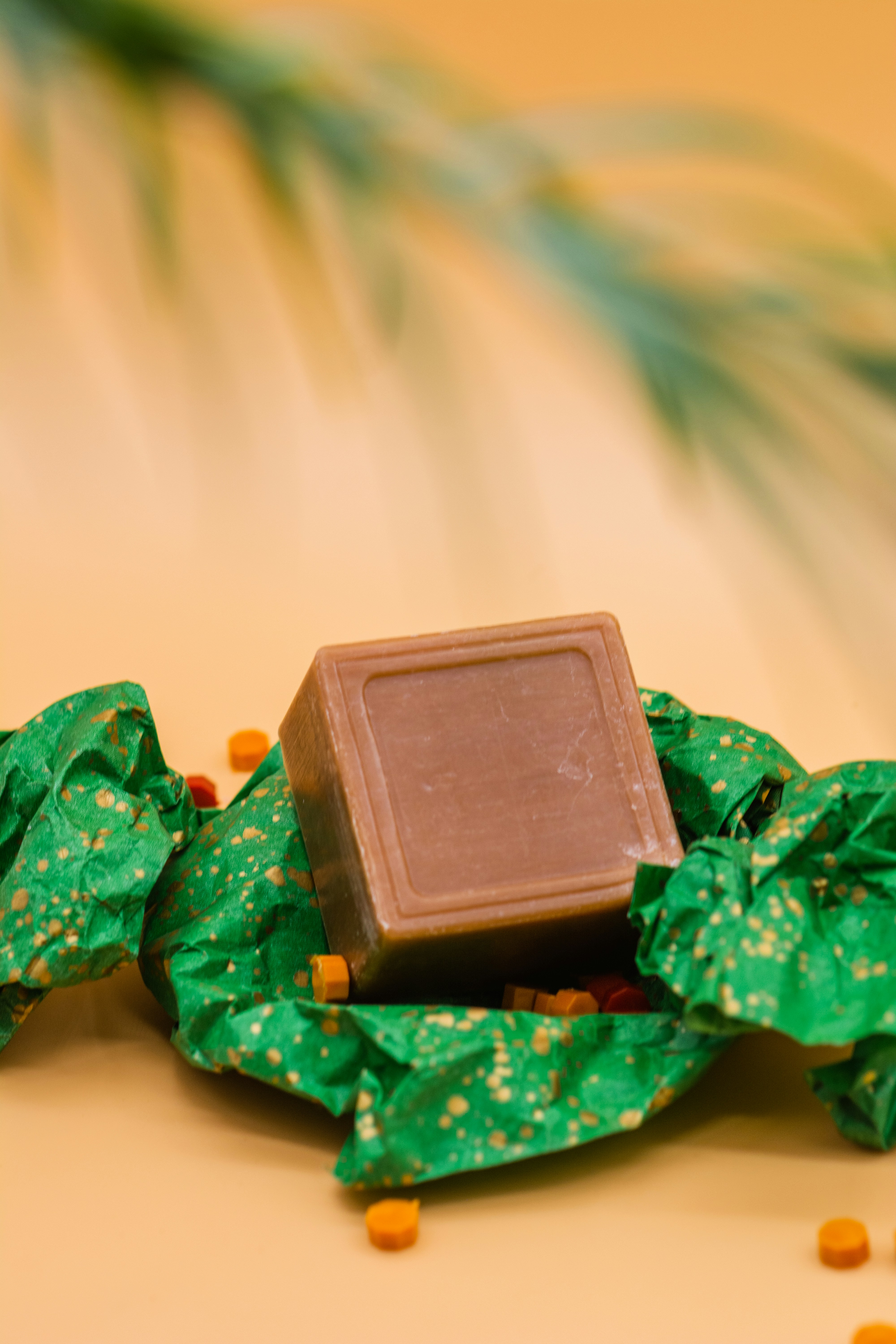 green plastic toy on white textile