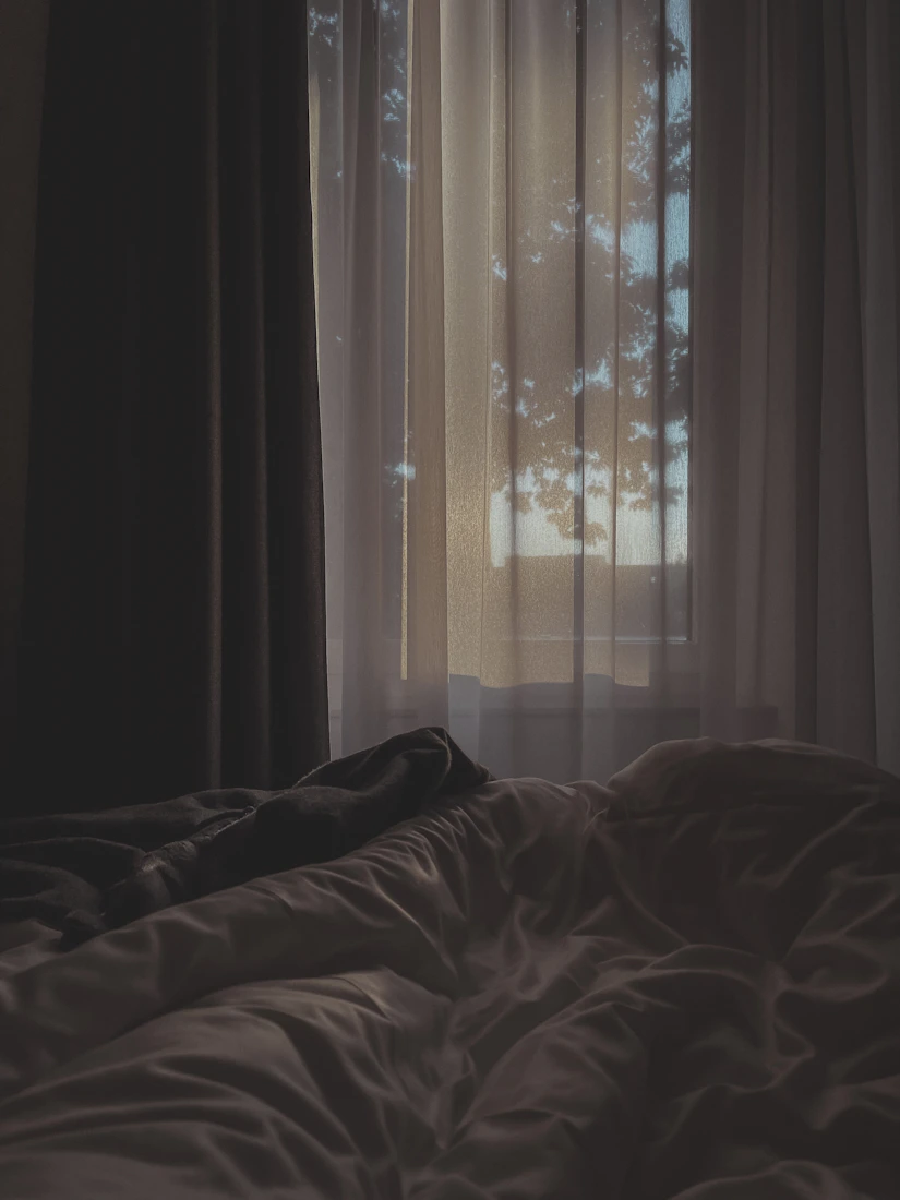Cork Room with soft white linen and warm morning light
