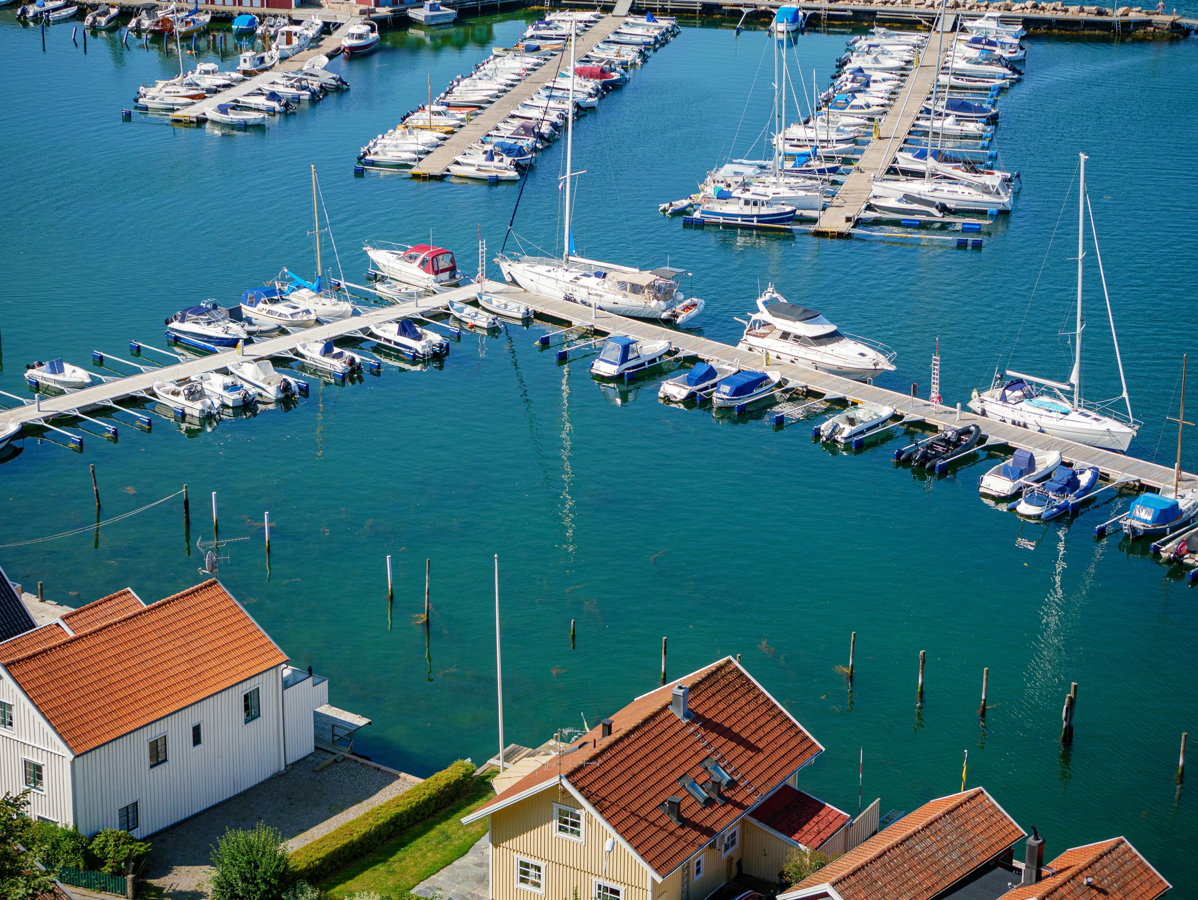 white and brown boat on body of water during daytime