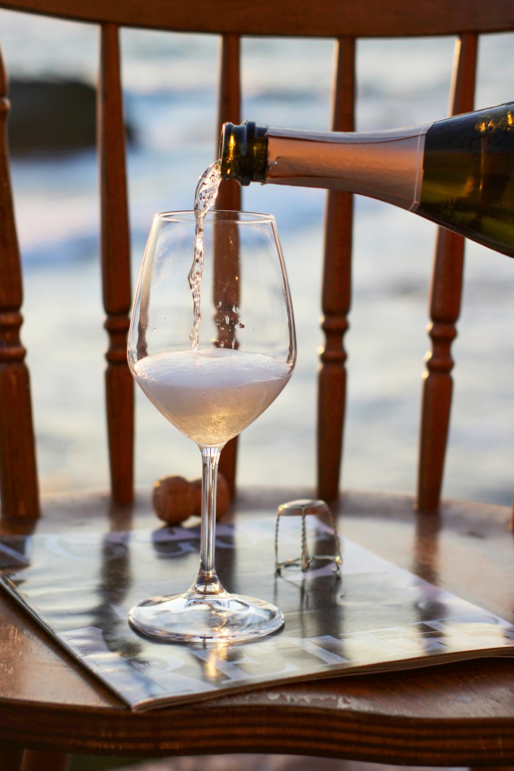 clear wine glass with clear liquid inside