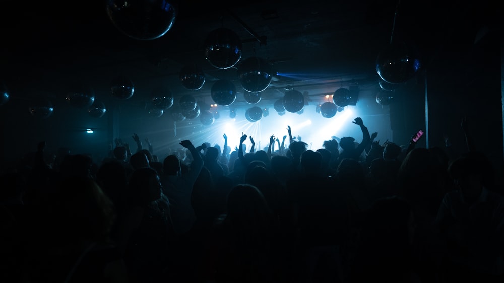 silhouette of people watching concert