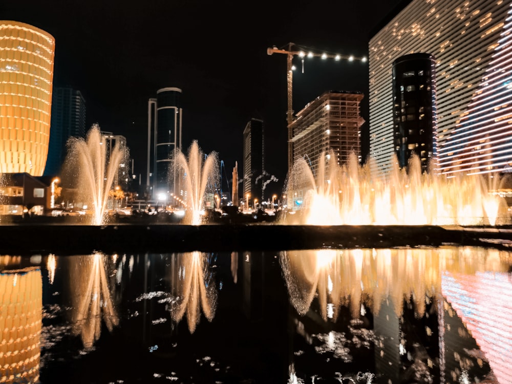 water fountain in the city during night time