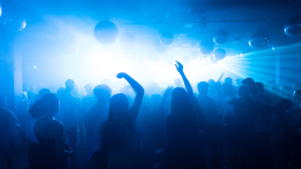 a group of people dancing at a party