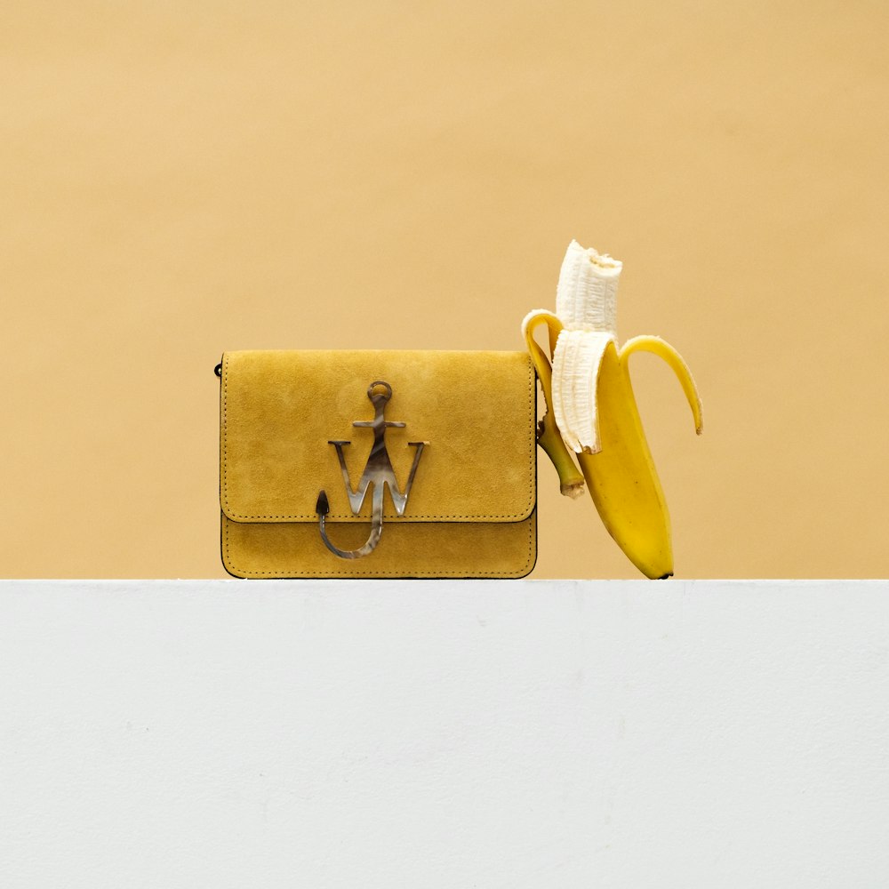 yellow banana fruit on brown paper bag