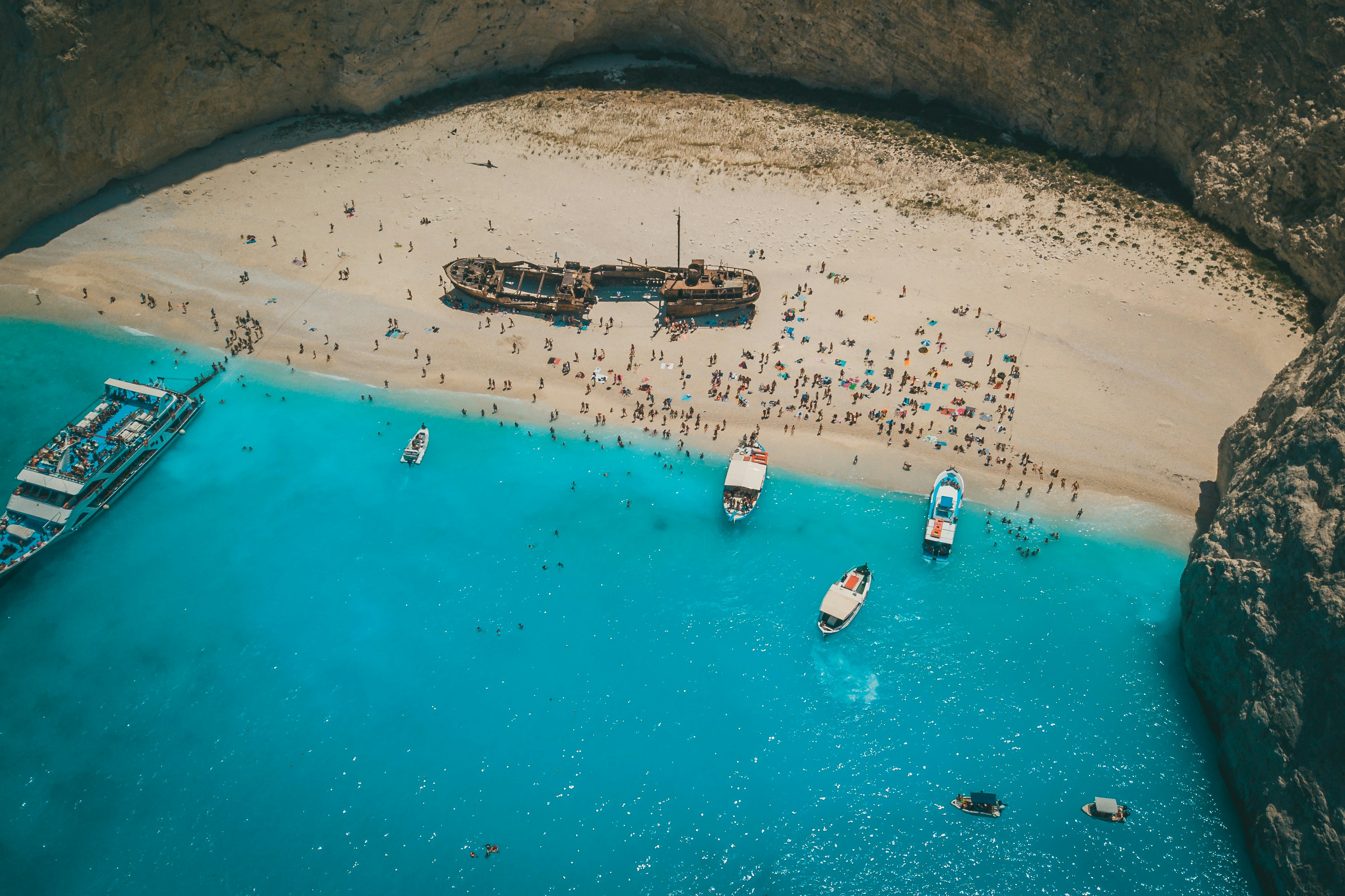 aerial view of boats on sea shore during daytime