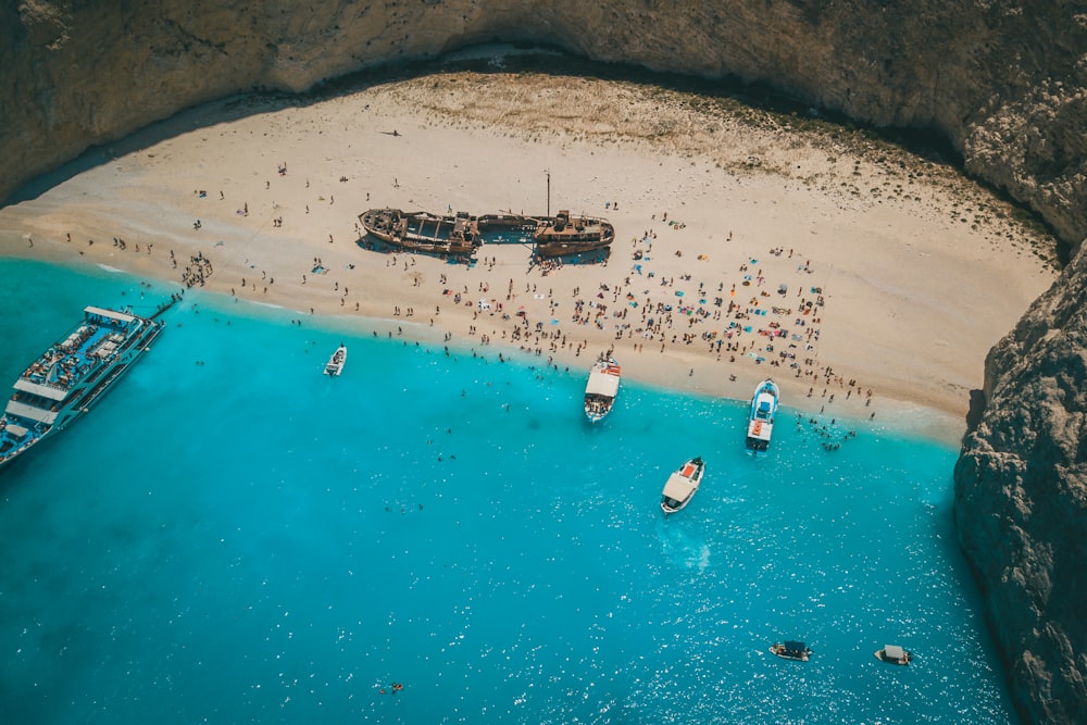 aerial view of boats on sea shore during daytime