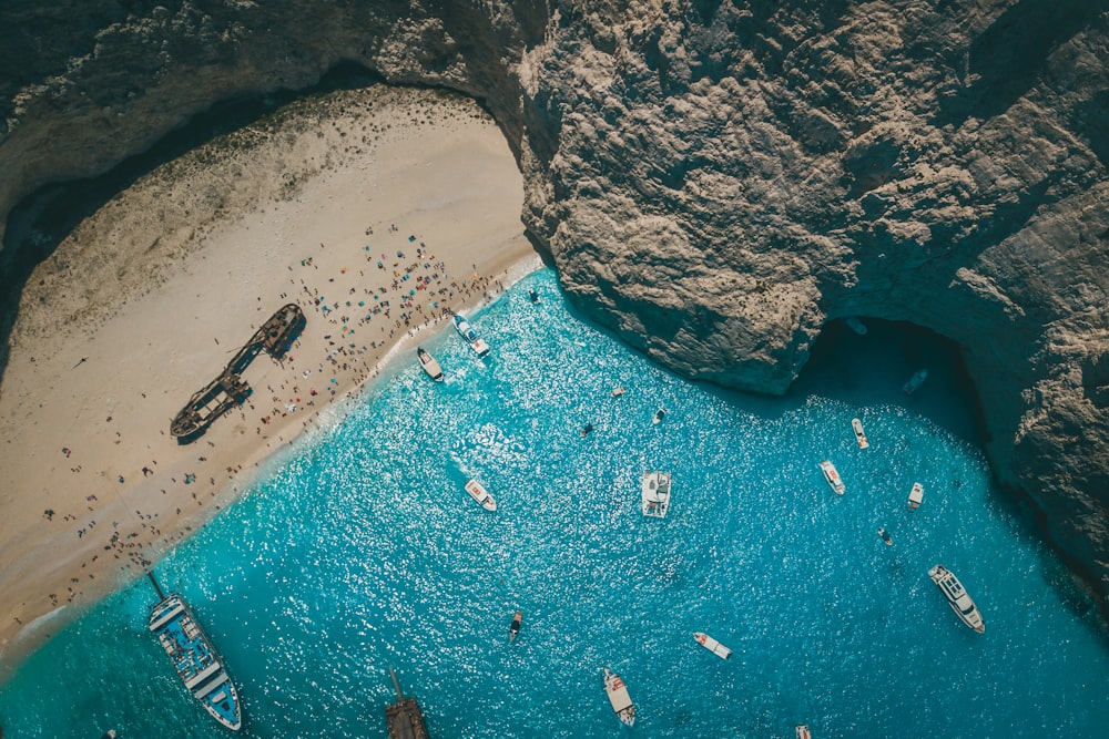 aerial view of boats on sea shore during daytime