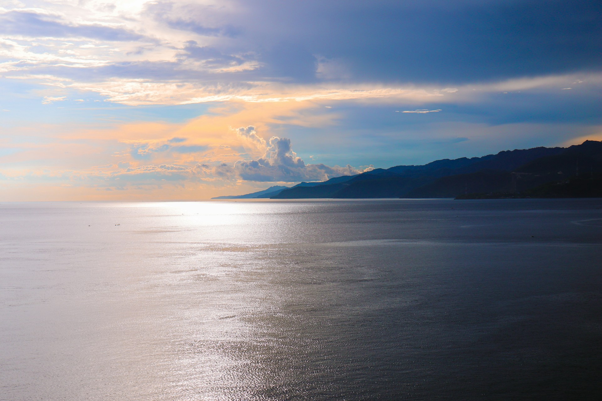 body of water under cloudy sky during daytime