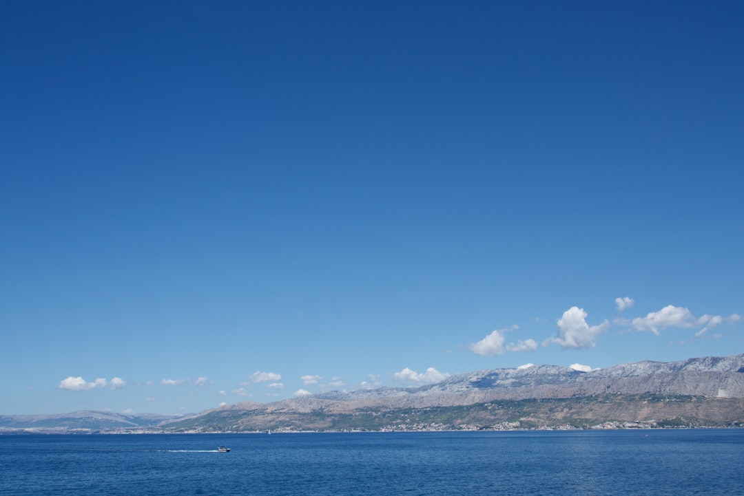 blue sea under blue sky during daytime