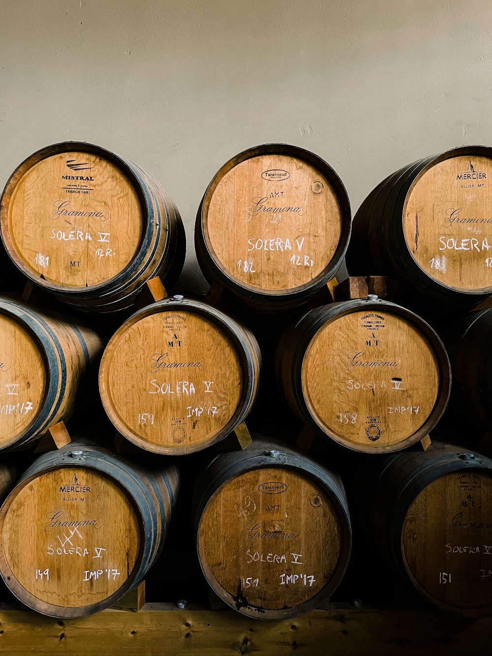 brown wooden barrels on gray concrete floor