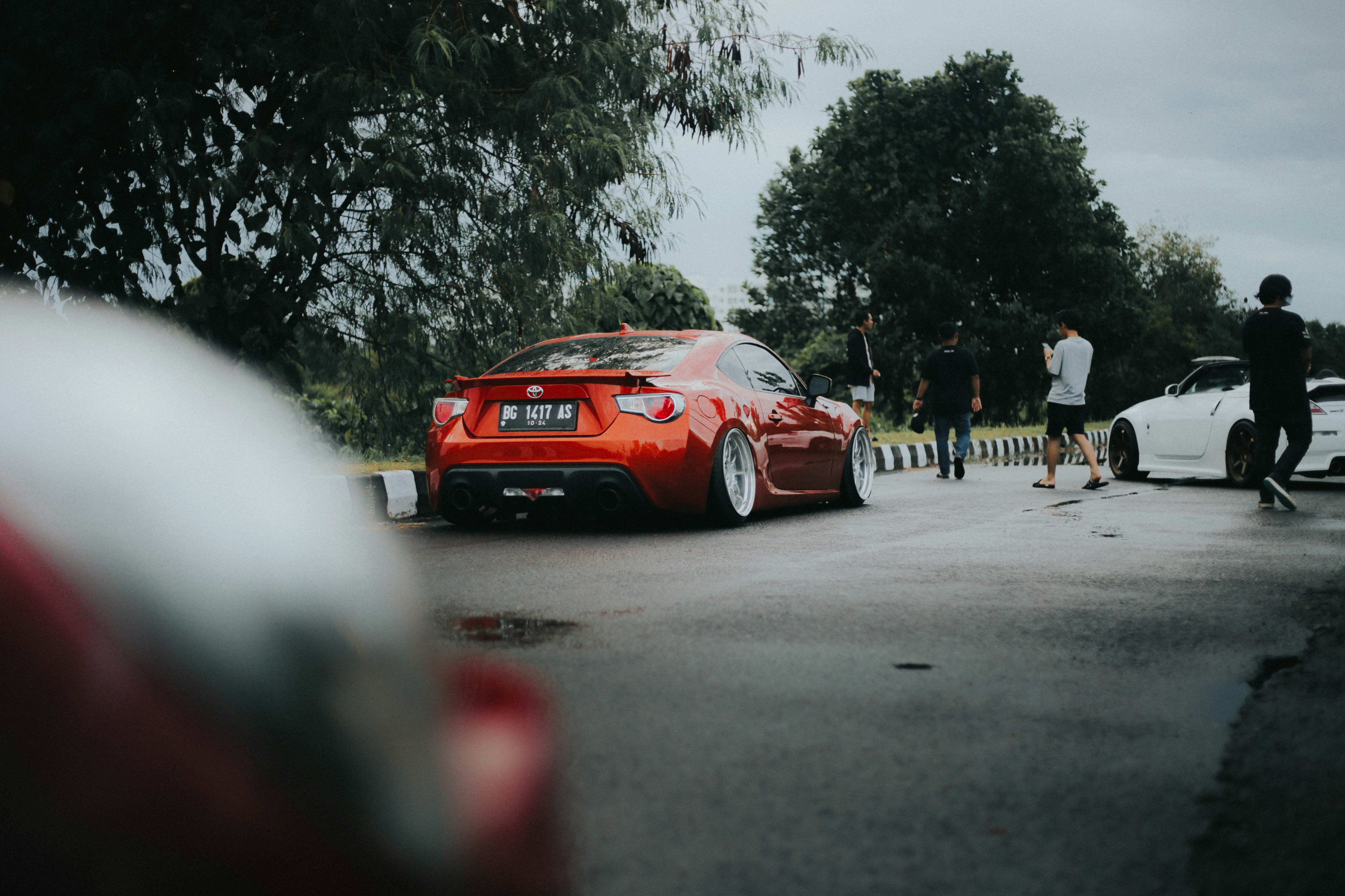 red audi r 8 on road during daytime