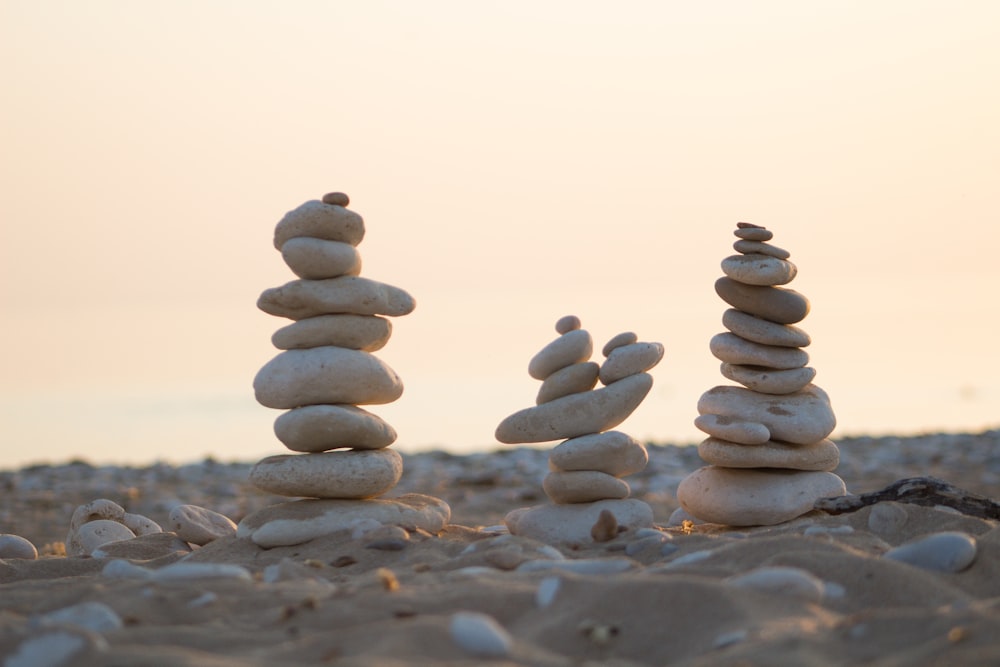 stack of stones on gray sand