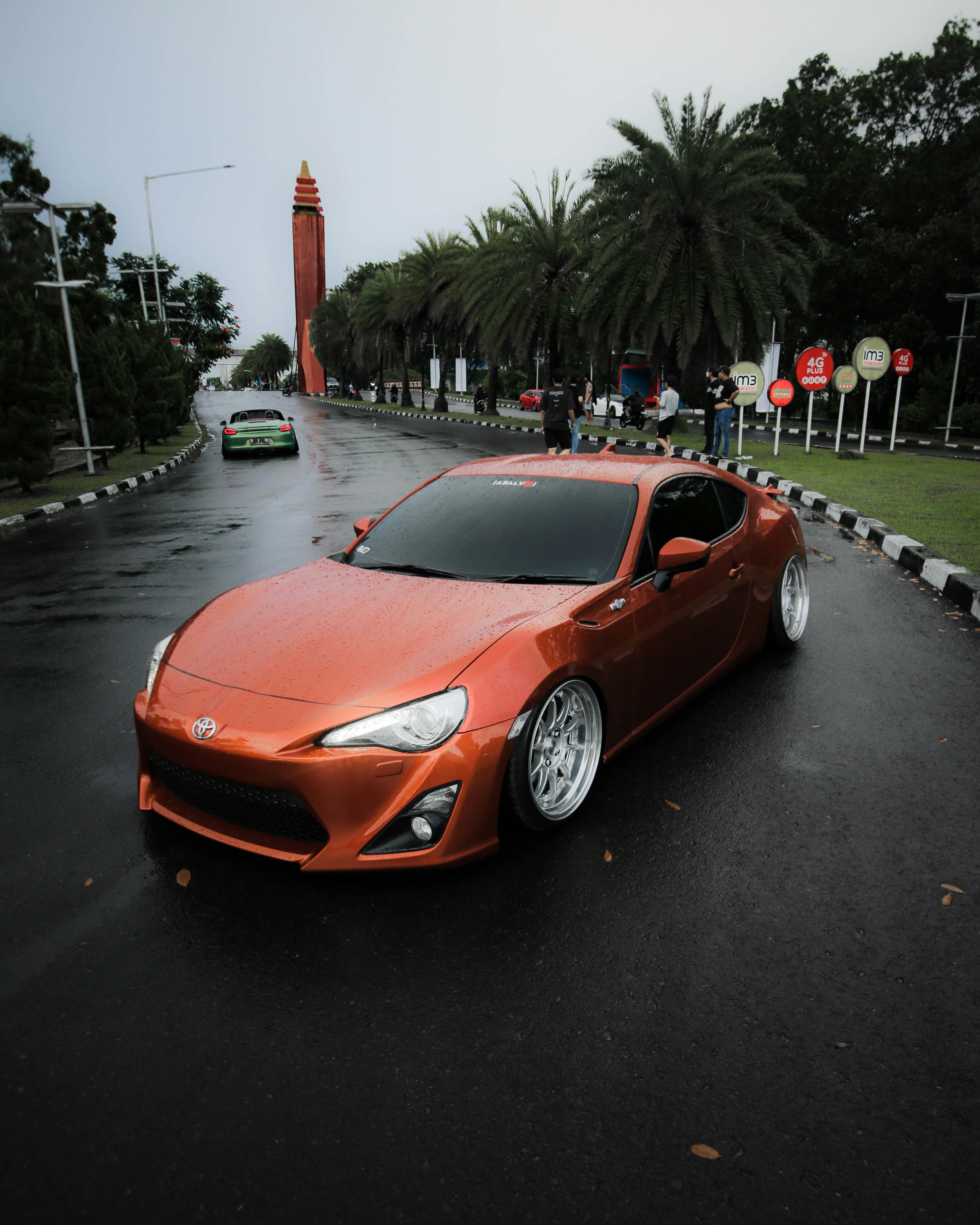 red ferrari 458 italia on road during night time