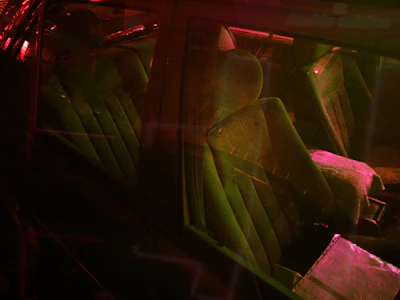 Colorful LED strips glowing softly inside a modern vehicle cabin at night.