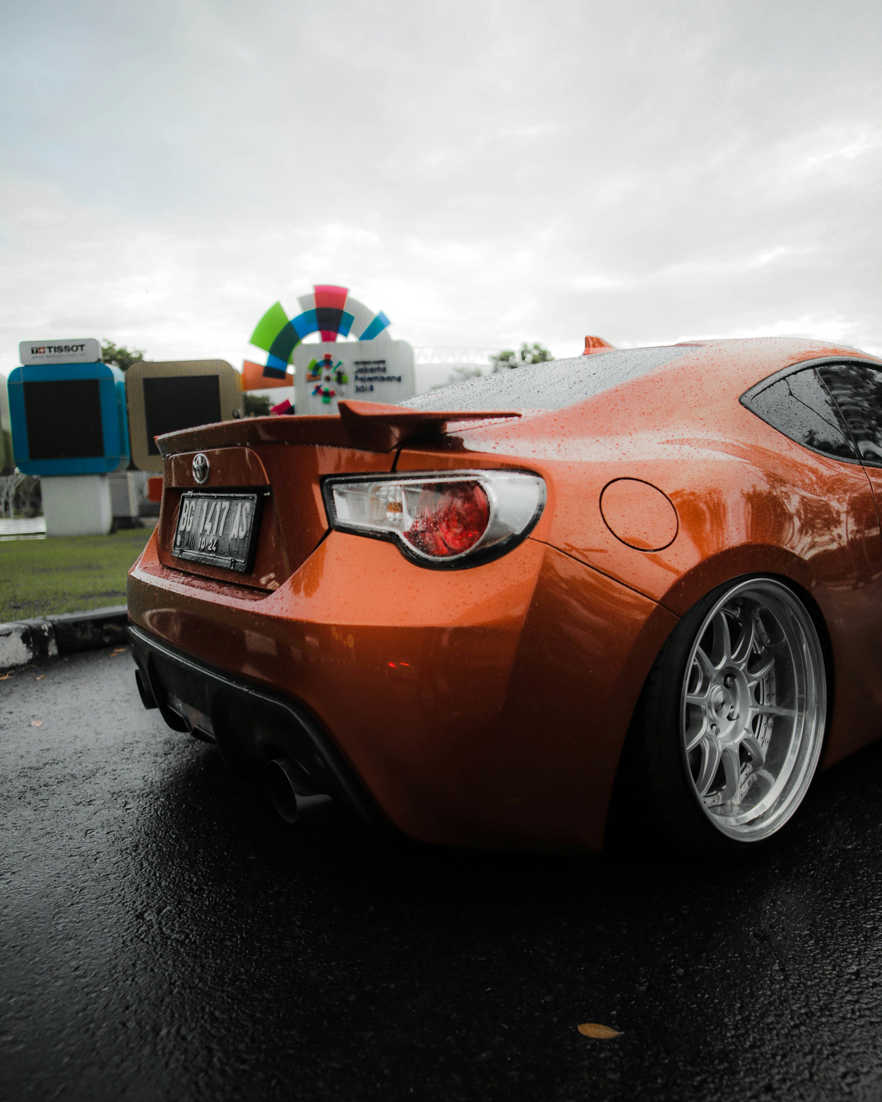 orange car on road during daytime