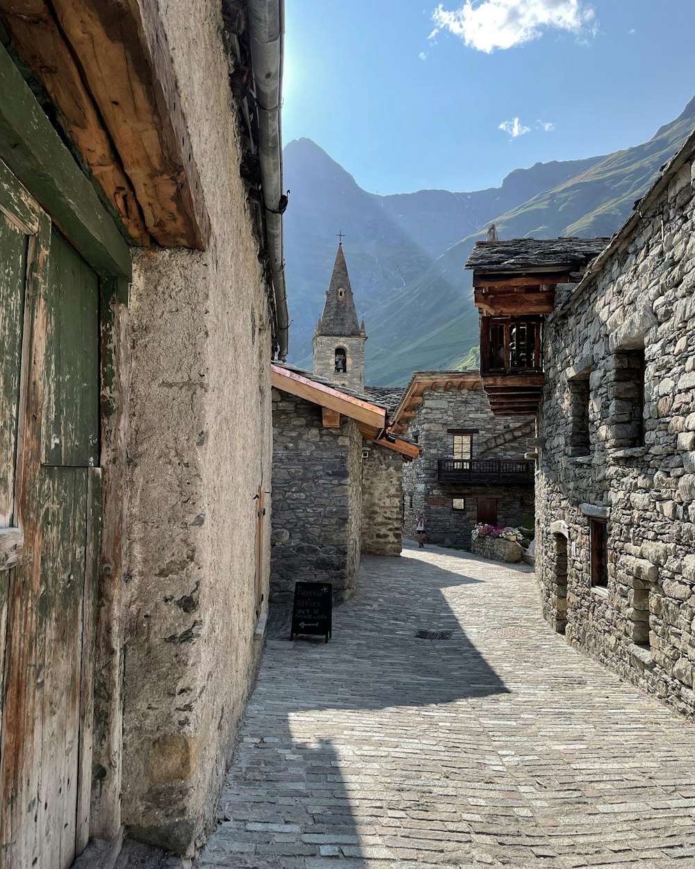 brown brick building near mountain during daytime