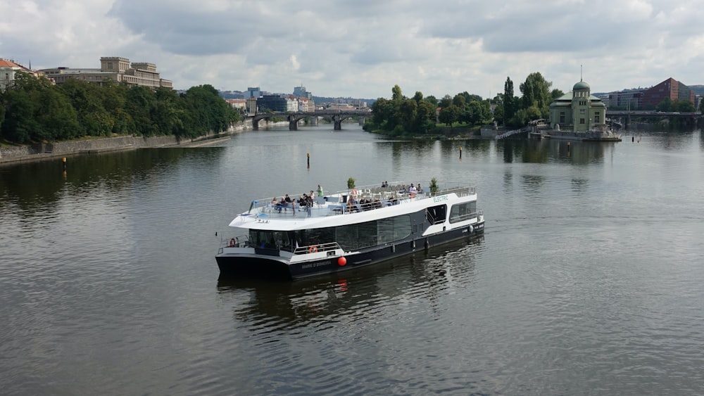 white and black boat on water during daytime