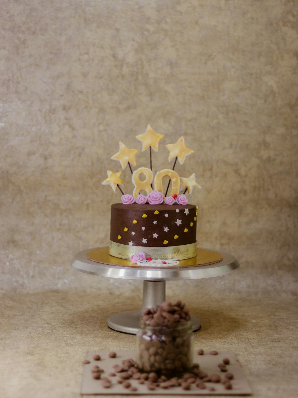 yellow and black round cake with yellow flower accent