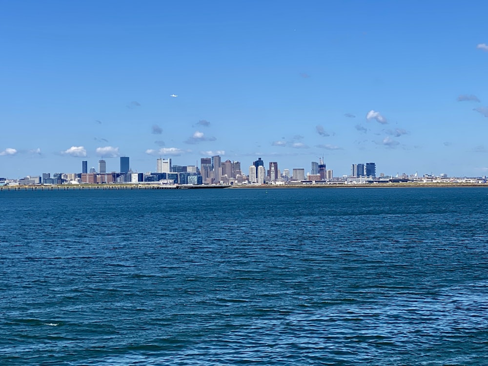 city skyline across body of water during daytime