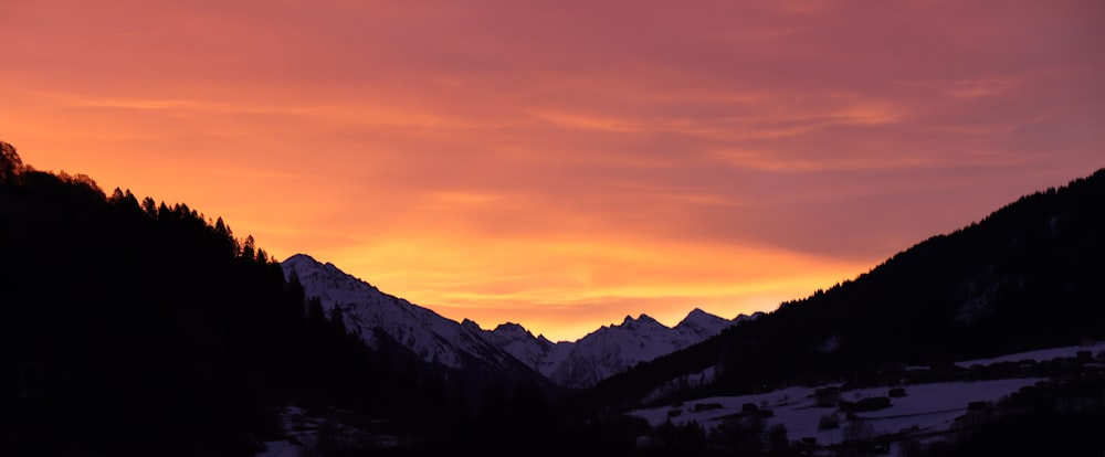 silhouette of mountains during sunset