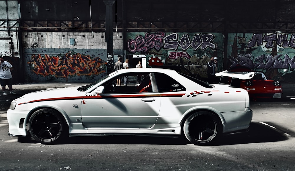 white porsche 911 parked on street