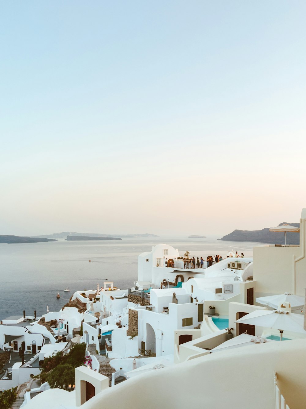 white concrete houses near sea during daytime