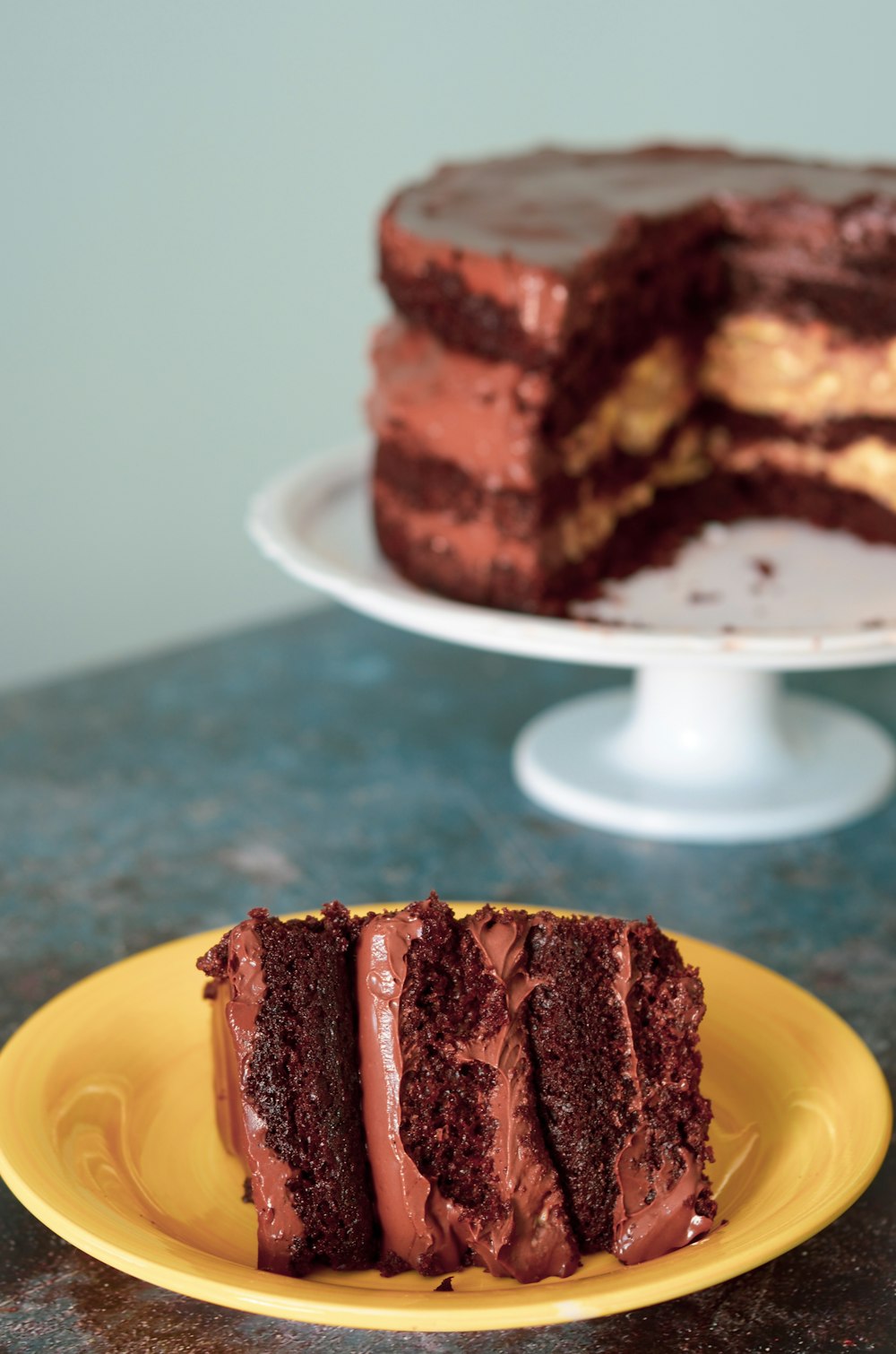 brown and white cake on yellow plate