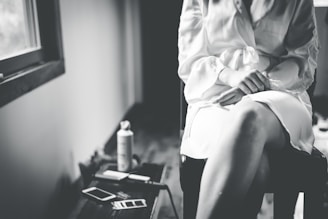 woman in white dress shirt and black skirt